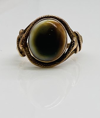 Lot 631 - A yellow metal cabochon set dress ring with...