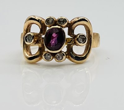 Lot 632 - An 18ct yellow gold diamond and ruby dress...
