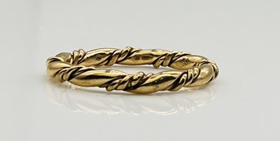 Lot 635 - A 9ct yellow gold twisted wedding band, approx...