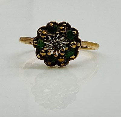 Lot 637 - A 9ct yellow gold small emerald flower head...