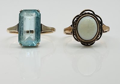 Lot 640 - A 9ct yellow gold opal ring and a yellow metal...