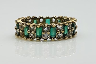 Lot 643 - A yellow metal paste set full eternity ring,...