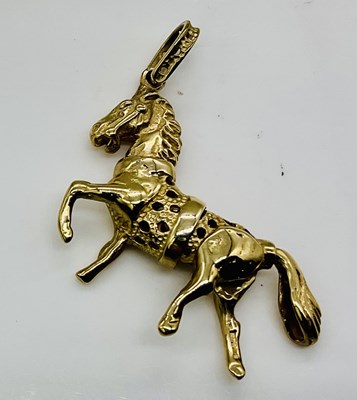 Lot 644 - A 9ct yellow gold novelty articulated horse...