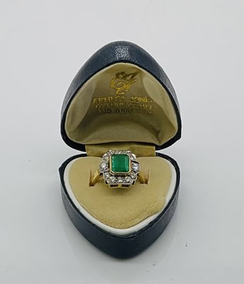 Lot 645 - An 18ct yellow gold emerald and diamond ring...