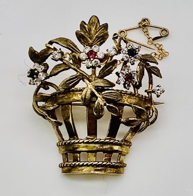 Lot 647 - A 9ct yellow gold giardinetti brooch set with...