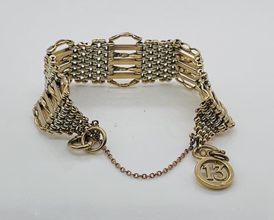 Lot 648 - A 9ct yellow gold gate link bracelet, approx...