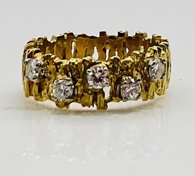 Lot 651 - An 18ct yellow gold textured pierced wedding...