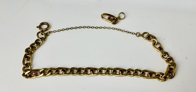 Lot 656 - A 9ct yellow gold garnet set bracelet, sold...