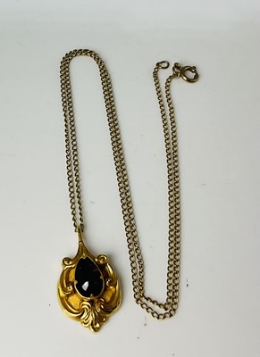 Lot 658 - A 9ct yellow gold fine link chain, suspending...
