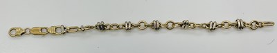 Lot 665 - A 9ct yellow and white gold bracelet, length...