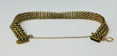 Lot 670 - A 9ct yellow gold flat link bracelet, approx...