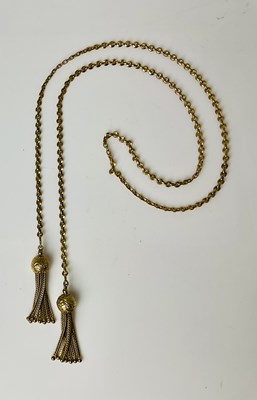 Lot 691 - A 9ct yellow gold chain with twin tassel ends,...