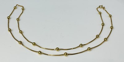 Lot 692 - A 9ct yellow gold box link and sphere chain,...