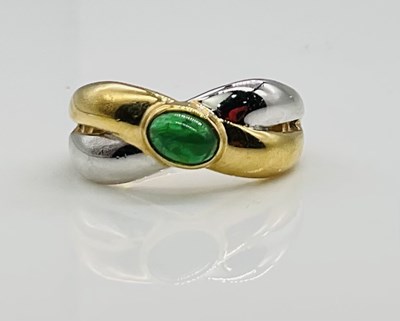 Lot 705 - A two tone emerald cabochon set ring, stamped '...