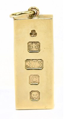 Lot 1317 - A substantial 9ct yellow gold ingot pendant...