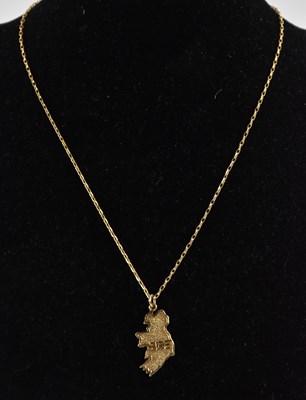 Lot 1273 - A 9ct yellow gold pendant modelled as Ireland,...