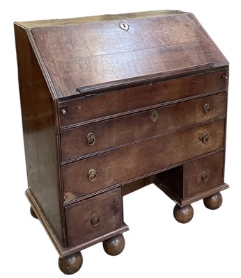 Lot 15 - An 18th century oak bureau, with fall front...
