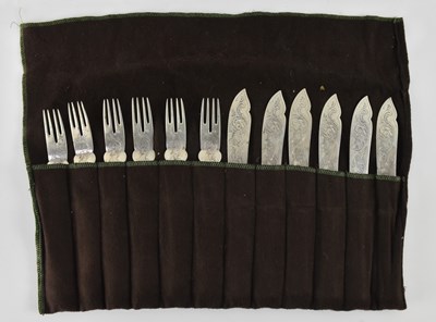 Lot 1114 - A set of six 800 grade silver fish knives and...
