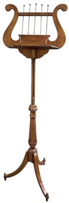 Lot 37 - A reproduction mahogany tripod music stand,...
