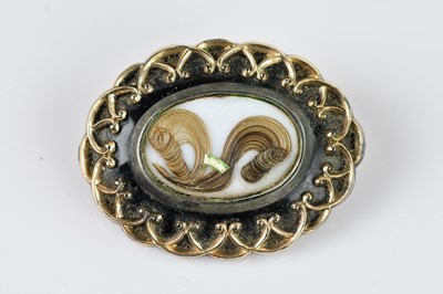 Lot 1344 - A Victorian yellow metal and black enamel...