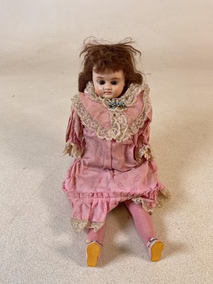 Lot 107 - A reproduction bisque head doll, with no...