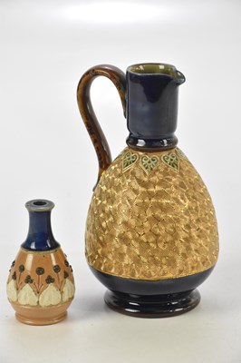Lot 1953 - ROYAL DOULTON; a Doulton Lambeth ewer, height...