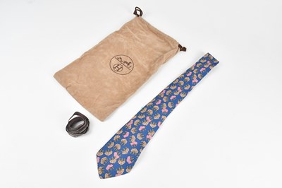 Lot 140 - HERMÈS; a 100% silk royal blue tie, with pink...