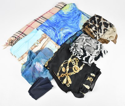 Lot 104 - TORY BURCH; a large 100% silk black tan and...