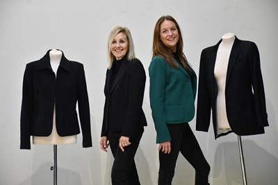 Lot 370 - THEORY; a hunter green short lined fitted wool...