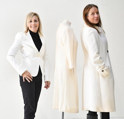 Lot 271 - ARMANI COLLEZIONI; a cream 100% wool knee...