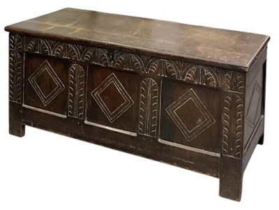 Lot 36 - An 18th century carved oak coffer, with hinged...