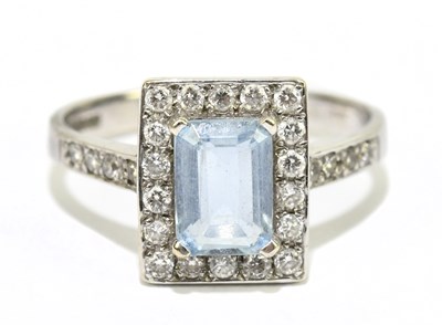 Lot 61 - A 9ct white gold diamond and aquamarine ring...