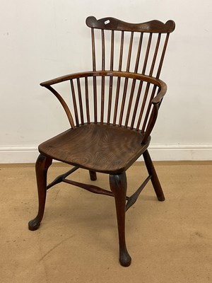 Lot 742 - A Georgian oak and elm comb back West Country...