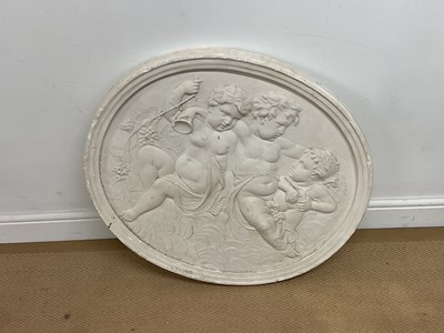 Lot 142 - A 20th century oval plaster plaque with...