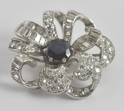 Lot 1298 - A white metal diamond and sapphire flower head...