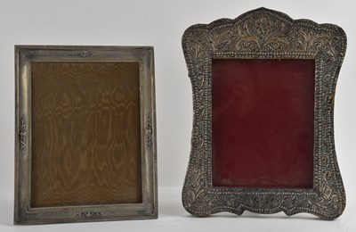 Lot 1153 - An elaborate white metal overlaid framed...