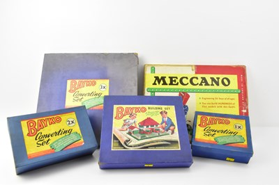 Lot 674 - MECCANO; a boxed Outfit No. 4, and four boxed...
