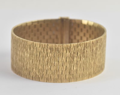 Lot 1304 - ROY CECIL KING (RCK); a wide 9ct yellow gold...