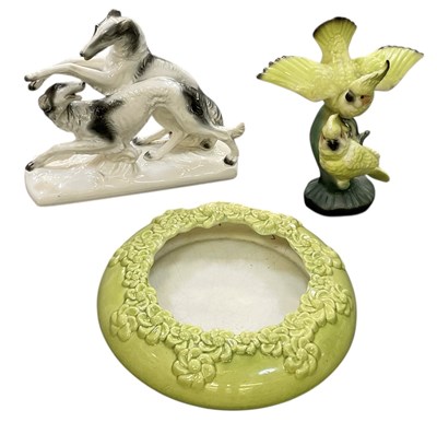 Lot 549 - ROYAL HAEGER; a green glazed floral decorated...