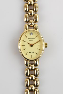 Lot 507 - ACCURIST; a lady's yellow metal cased...