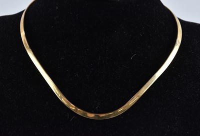 Lot 1263 - A handmade 9ct yellow gold torque style...