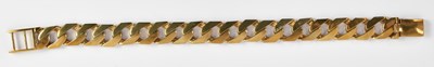 Lot 1305 - A 9ct yellow gold flat curb link bracelet with...