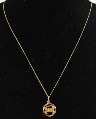 Lot 1284 - A 9ct yellow gold pendant cut away to...