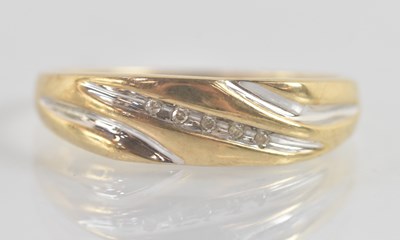 Lot 1245 - A 9ct yellow gold ring, with curved table...