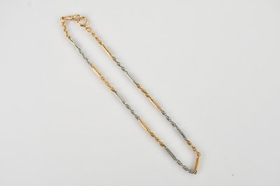 Lot 402 - A yellow and white metal trombone link albert...