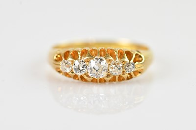 Lot 2338 - An 18ct yellow gold diamond five-stone ring,...