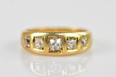 Lot 2427 - An 18ct yellow gold diamond five stone dress...
