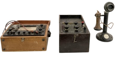 Lot 265 - An early 20th century bakelite stick telephone,...