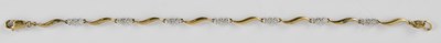 Lot 1309 - A 9ct yellow gold line bracelet, set with...
