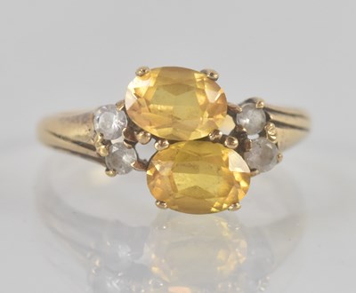 Lot 1233 - A 9ct yellow gold topaz and white stone...